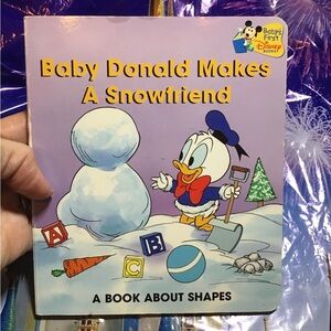 Disney baby Donald makes a snowfriend a book about shapes hardcover